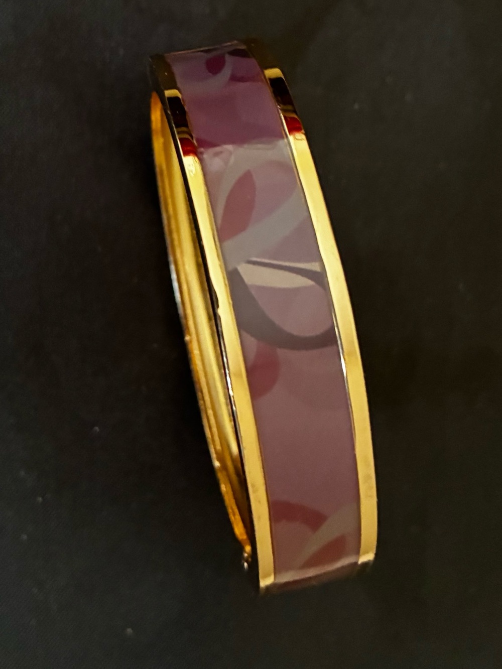 Avon oval bracelet with hues of purples